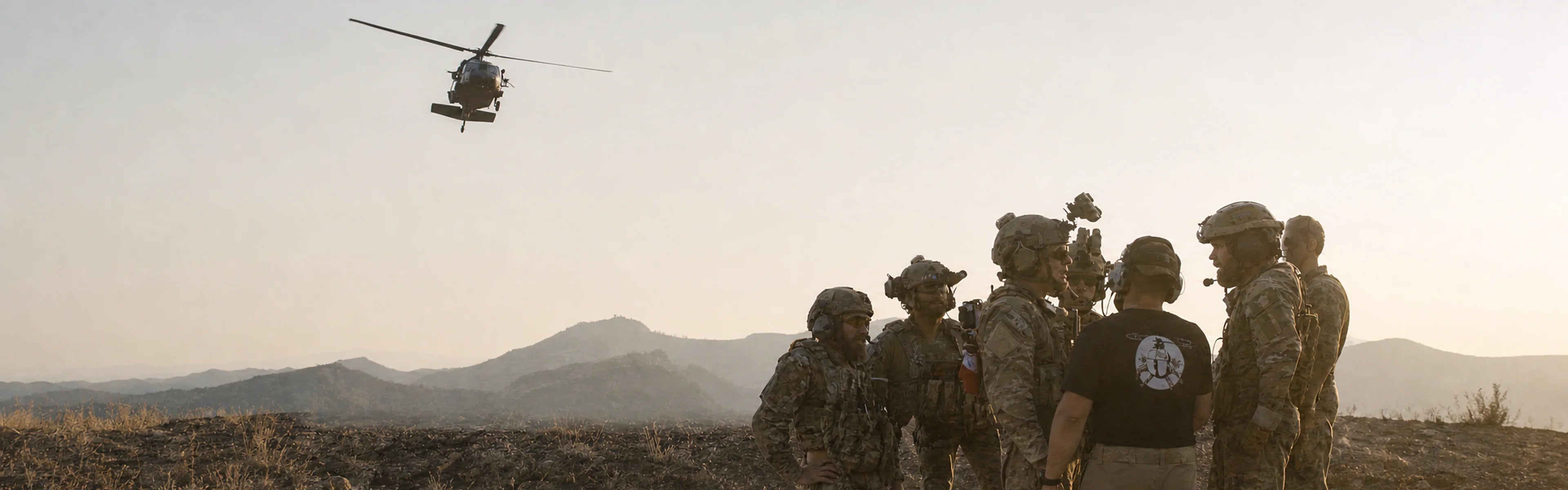 Mission Gear Pro tactical team with helicopter in a mountain environment